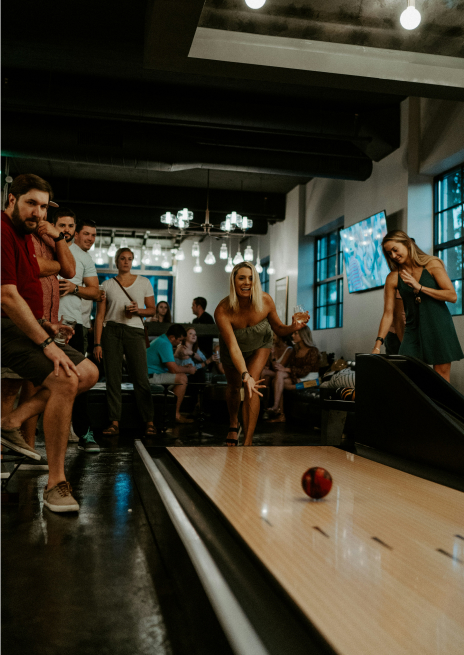 Group of friends enjoying a fun night out bowling for a unique double date or group date night idea
