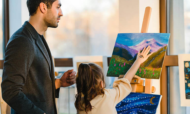 Parent and child painting together in a creative art class, a thoughtful family-friendly date idea