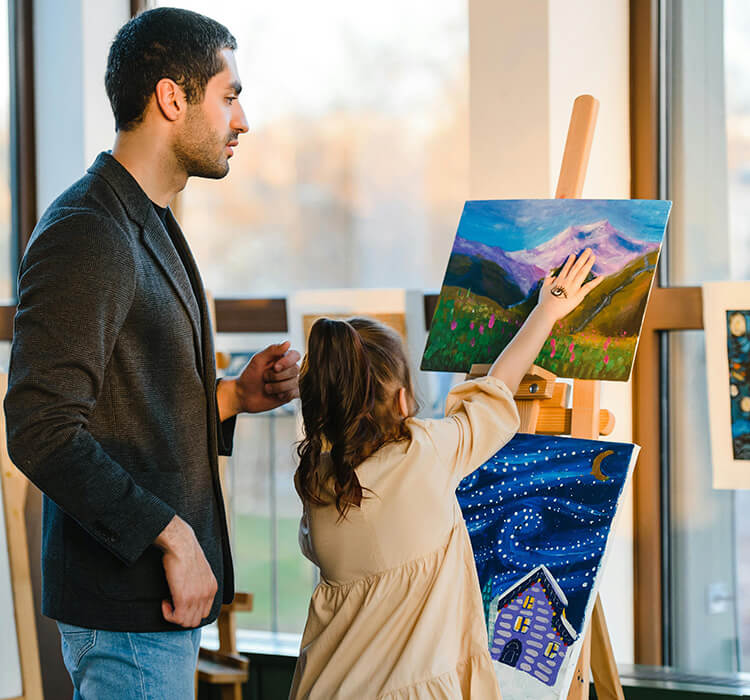 Parent and child painting together in a creative art class, a thoughtful family-friendly date idea